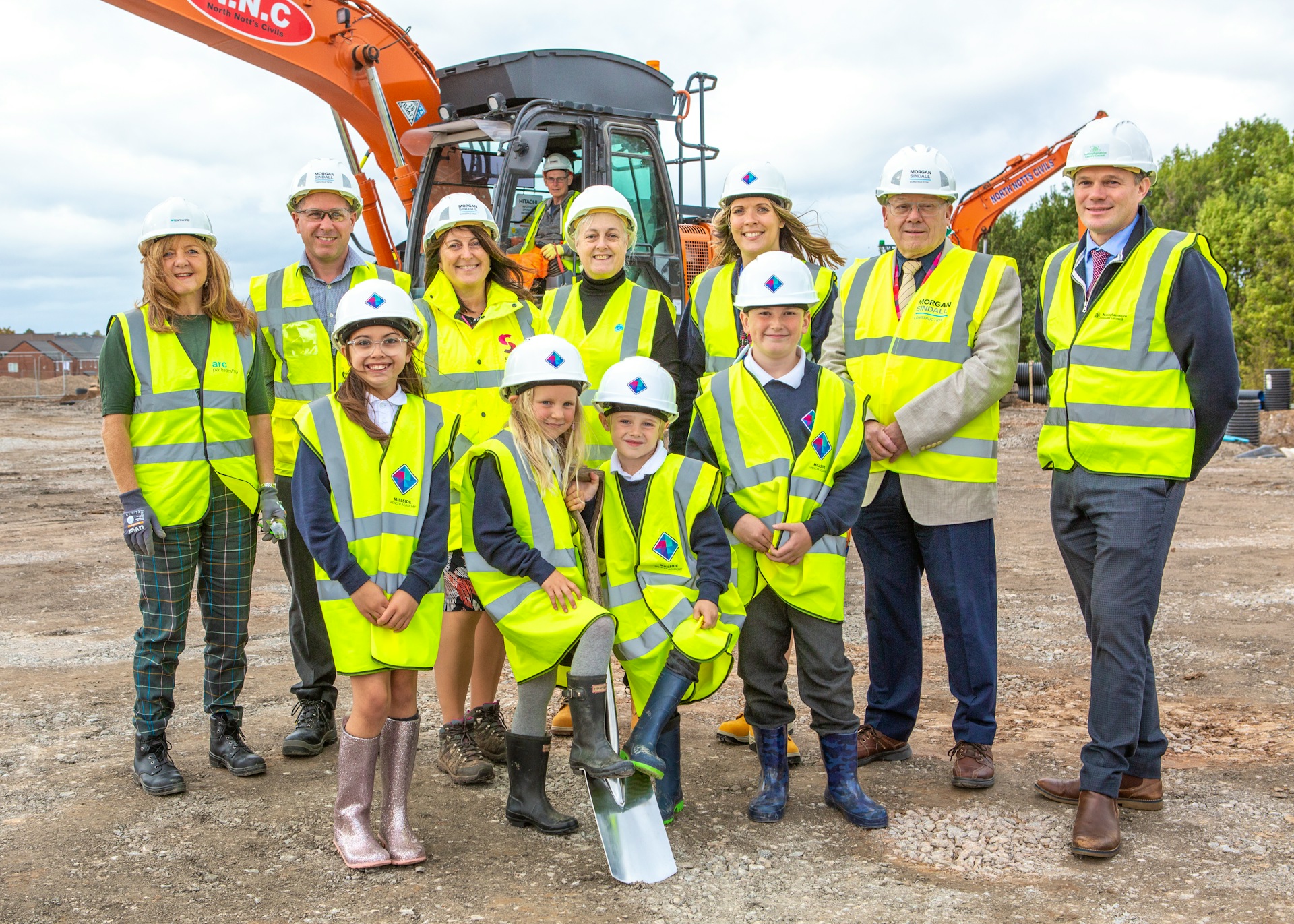 Photo of children and Arc Partnership staff at Millside Spencer Academy
