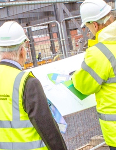 Nottinghamshire City Council construction workers reviewing a building design