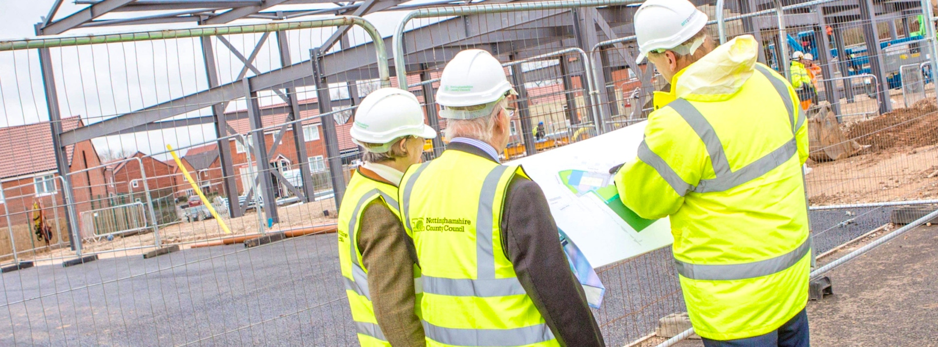 Nottinghamshire City Council construction workers reviewing a building design