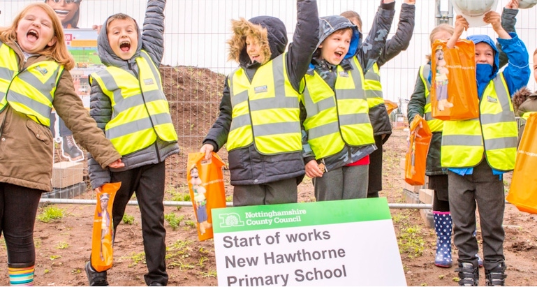 Photo of children celebrating the New Hawthorne Primary School work
